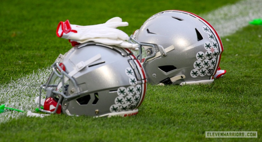 The Ohio State University football helmets and gloves