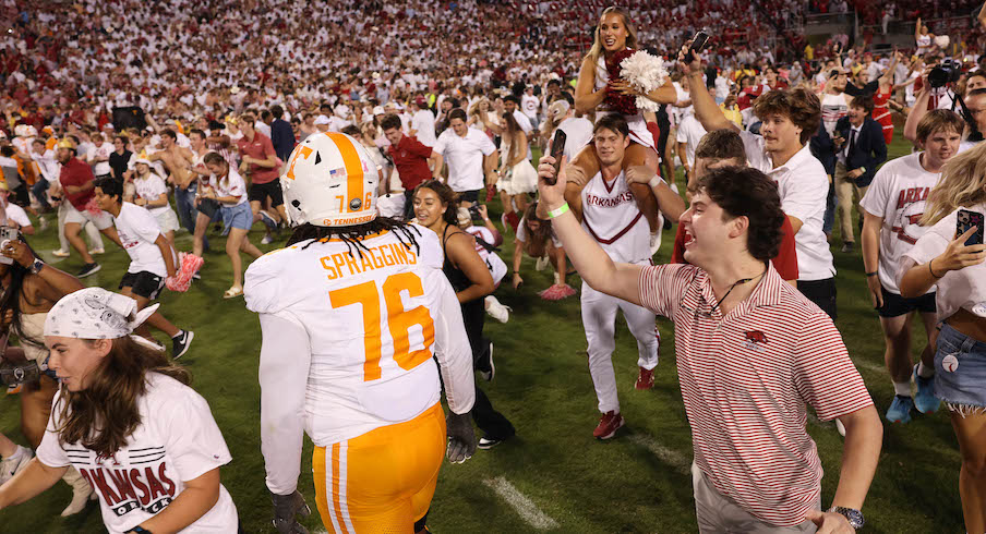 Arkansas fans celebrate the Razorbacks’ win over Tennessee