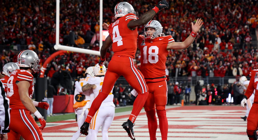 Jeremiah Smith celebrates with Will Howard