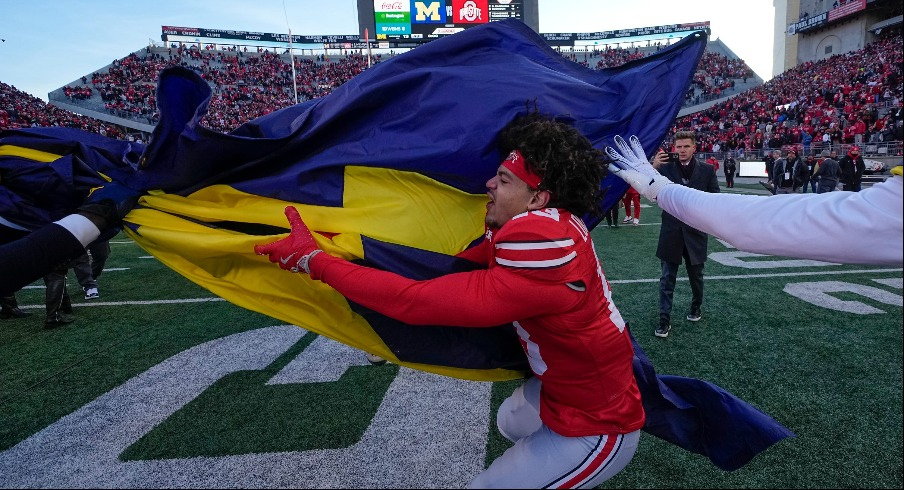 Miles Lockhart tears down the Michigan flag