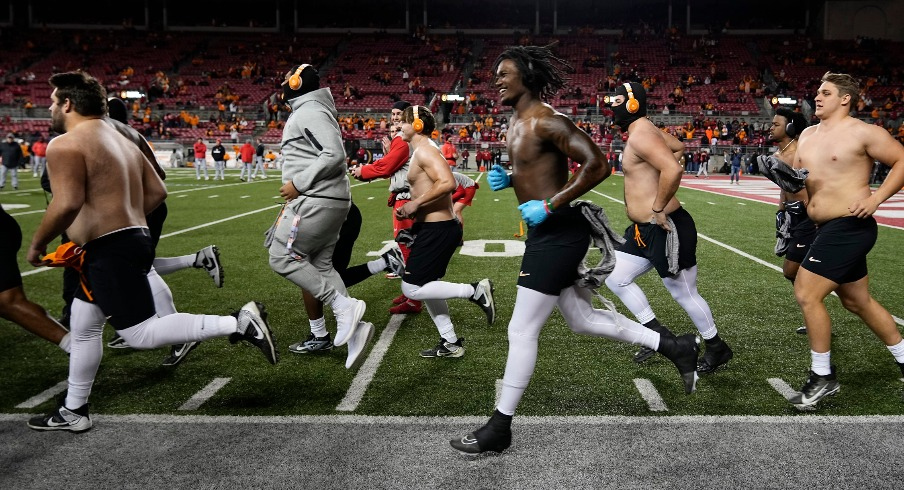 The Tennessee Volunteers take the field for warm ups without shirts in sub-freezing temperatures prior to the College Football Playoff first round game against the Ohio State Buckeyes at Ohio Stadium in Columbus on Dec. 21, 2024.