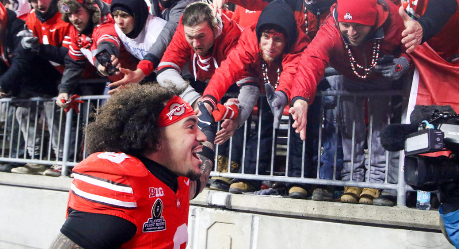 Ohio State player Lathan Ransom celebrates with fans