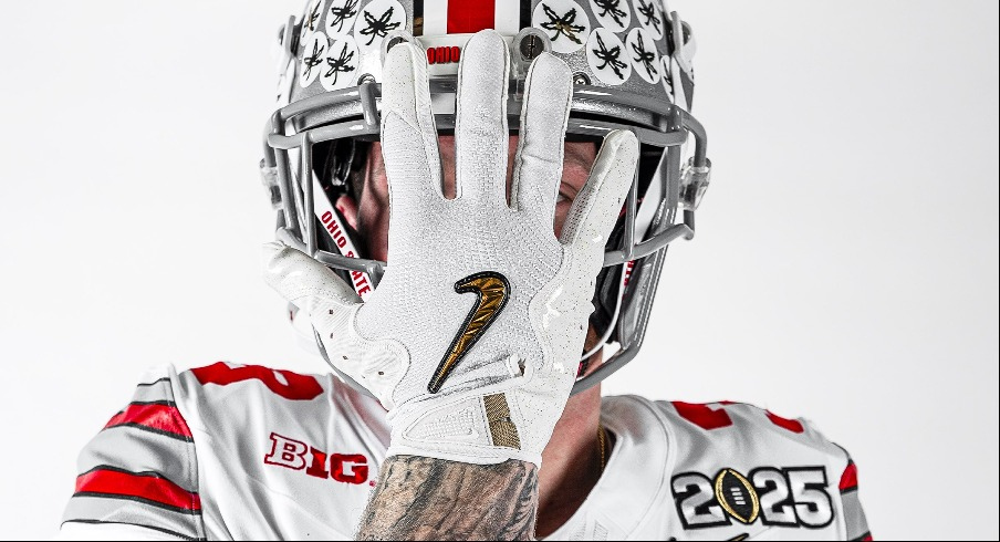 Jack Sawyer wearing Ohio State's white jersey with Heritage Stripes