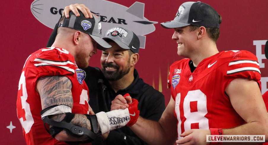 Jack Sawyer, Ryan Day and Will Howard embracing