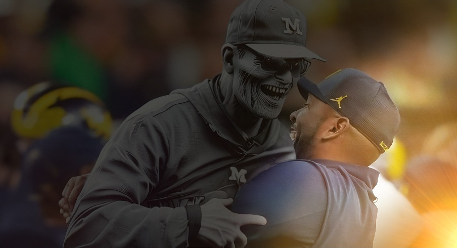 Michigan offensive coordinator Sherrone Moore picks up head coach Jim Harbaugh after they won the College Football Playoff national championship game against Washington at NRG Stadium in Houston, Texas on Monday, January 8, 2024.