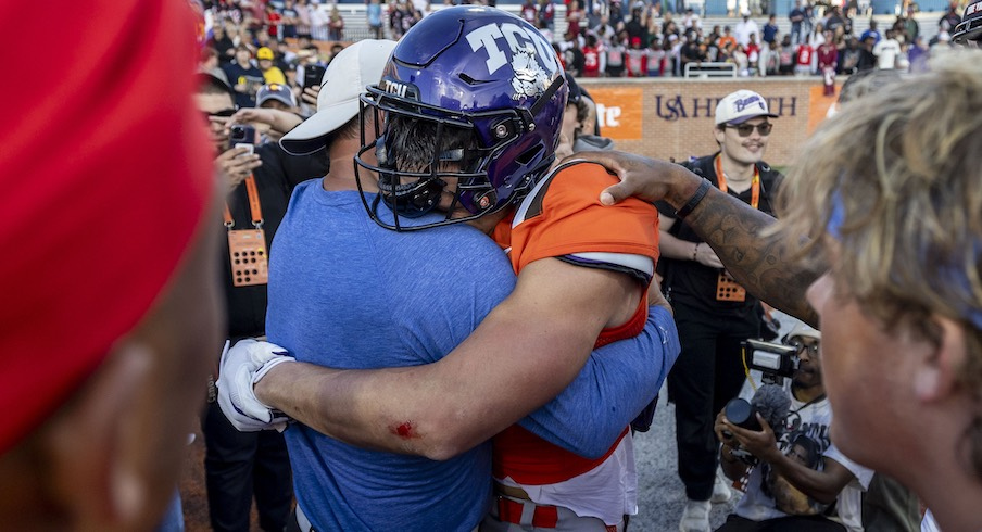 Jack Bech hugging his uncle, Brett, after his game-winning touchdown catch