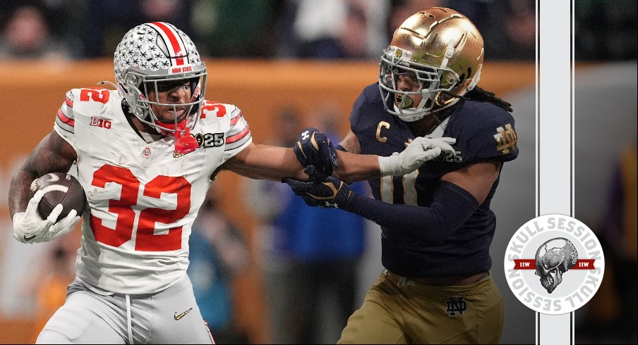 TreVeyon Henderson stiff arms a Notre Dame defender