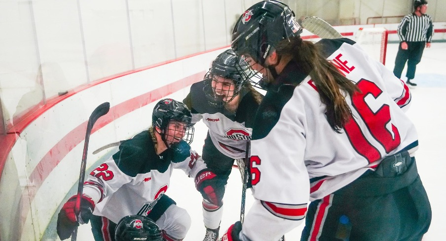 Joy Dunne celebrating with teammates